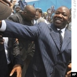Gabon President Ali Ben Bongo Ondimba greets supporters (file photo)