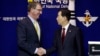 U.S. Defense Secretary Ashton Carter, left, shakes hands with his South Korean counterpart, Han Min Koo, after a joint news conference at the Defense Ministry in Seoul, South Korea, April 10, 2015. 