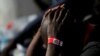 FILE: A migrant intercepted aboard a dinghy off the coast in the Mediterranean Sea, is seen with scabies on his body, after arriving on a rescue at the port of Malaga, southern Spain July 7, 2018.