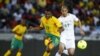 South Africa's Kagisho Dkgacoi (L) is challenged by Algeria's Adlane Guedioura during their international friendly soccer match in Soweto, January 12, 2013, in preparation for the 2013 Africa Cup of Nations. 