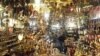People browse at a stall selling festival lights and Ramadan lanterns - or 'fawanees Ramadan' - at the Khan el-Khalili market in old Cairo, July 20, 2012.