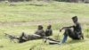 M23 rebel fighters guard the venue of a news conference in Bunagana, eastern Democratic Republic of Congo, Jan. 3, 2013. 