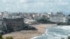 People swim in the sea and walk on the beach in Biarritz, on Aug. 13, 2019. 