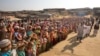 FILE - Rohingya children and refugees raise their hands and shout that they won't go back to Myanmar during a demonstration at Kutupalong near Cox's Bazar, Bangladesh, Jan. 22, 2018. 