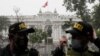 Police stand guard outside Congress where lawmakers are deciding their vote of confidence in Lima, Peru, Friday, Aug. 27, 2021. The vote of confidence is a legal mechanism to approve the cabinet of Peruvian President Pedro Castillo, a few weeks…