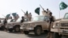 FILE - In this March 30, 2015, file photo provided by the Saudi Press Agency (SPA), Royal Saudi Land Forces and units of Special Forces of the Pakistani army take part in a joint military exercise in Baha region, southwest Saudi Arabia.