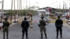 FILE - Colombian police officers and soldiers patrol the border between Colombia and Venezuela, in Paraguachon, Colombia, Sept. 9, 2015. The U.N. human rights office is asking for the release of 59 Colombian nationals being detained in Venezuela. 