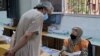 A Libyan man registers to vote inside a polling station in Tripoli, on Nov. 8, 2021.