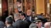 Republican presidential nominee Donald Trump waves to supporters outside the front door of Trump Tower where he lives in the Manhattan borough of New York, Oct. 8, 2016. 