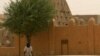 A man walks past the Sankore Mosque, a UNESCO World Heritage Site, in Timbuktu, Mali, April 11, 2012.