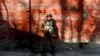 FILE - An Indian paramilitary soldier stands guard in Srinagar, Indian-controlled Kashmir, Jan. 25, 2015.