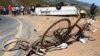 FILE - Two bikes were involved in an accident with a bus that crashed and turned on its roof near the town of Franschhoek, South Africa, March 7, 2015.