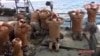 Photo, released by the Iranian state-run IRIB News Agency Jan. 13, 2016, shows detention of U.S. Navy sailors by the Iranian Revolutionary Guards in the Persian Gulf, Iran.