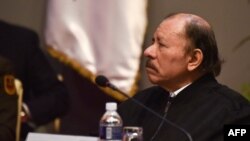 Nicaraguan President Daniel Ortega attends the XX Summit of the Bolivarian Alliance for the Peoples of Our America-People's Trade Agreement (ALBA-TCP), at the Palace of the Revolution in Havana on December 14, 2021. (Photo by Adalberto ROQUE / POOL / AFP)