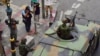 An armored vehicle rolls through the intersection adjacent to where a small anti-coup rally occurred in Bangkok, Thailand, June 1, 2014. (Steve Herman/VOA)