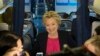 Democratic presidential candidate Hillary Clinton speaks with members of the media on board her campaign plane at Westchester County Airport in White Plains, N.Y., Sept. 27, 2016. 